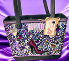 Decorative handbag with embellishments on a purple satin background, featuring the brand 'Luxelovebyyolanda'.